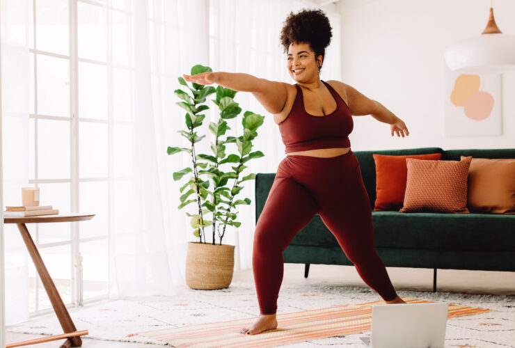 young Black woman doing yoga