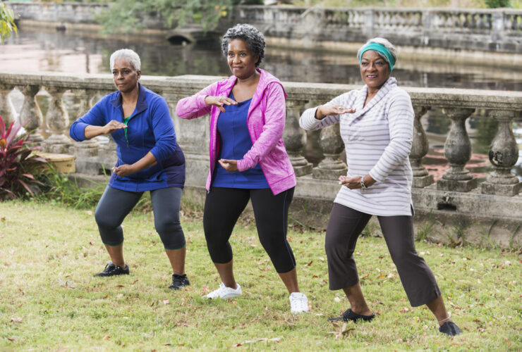 Senior black women practicing Tai Chi