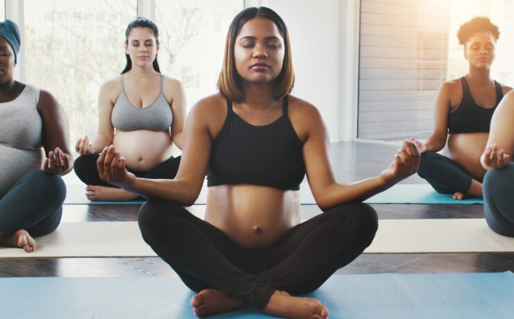 Women meditating while pregnant